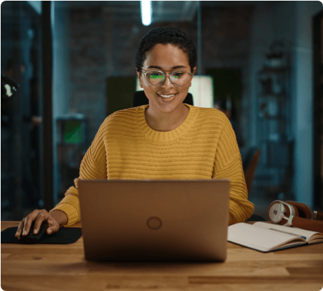 Virsec Industries Woman on Laptop with Glasses